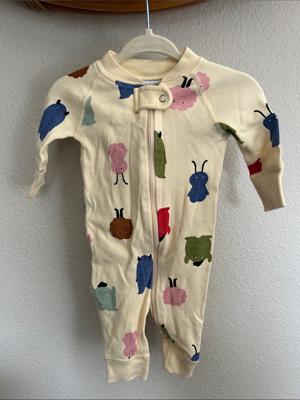 Hanna Andersson Cream Footie with Multicolor Creature Prints